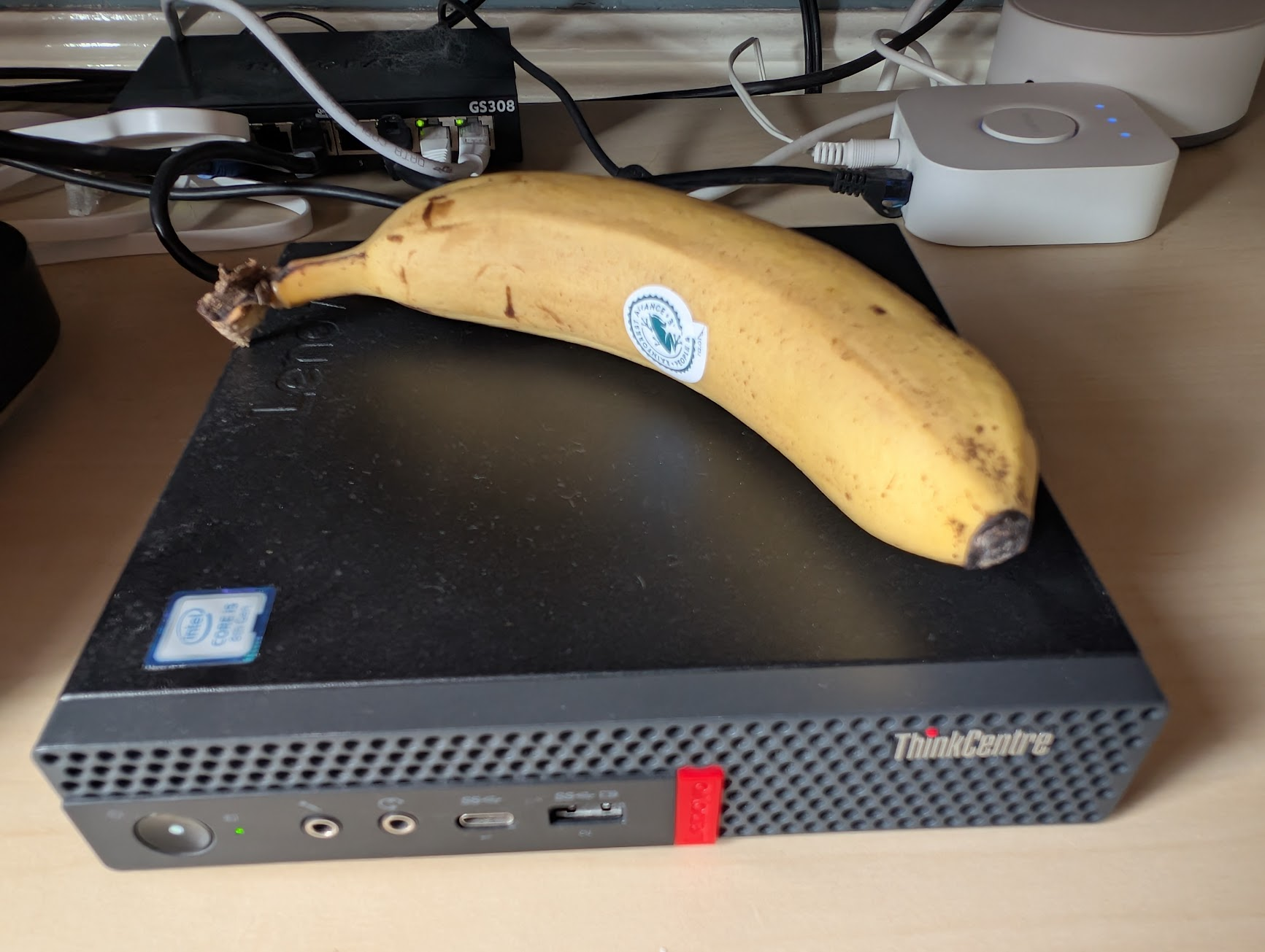ThinkCentre homelab server with banana for scale
